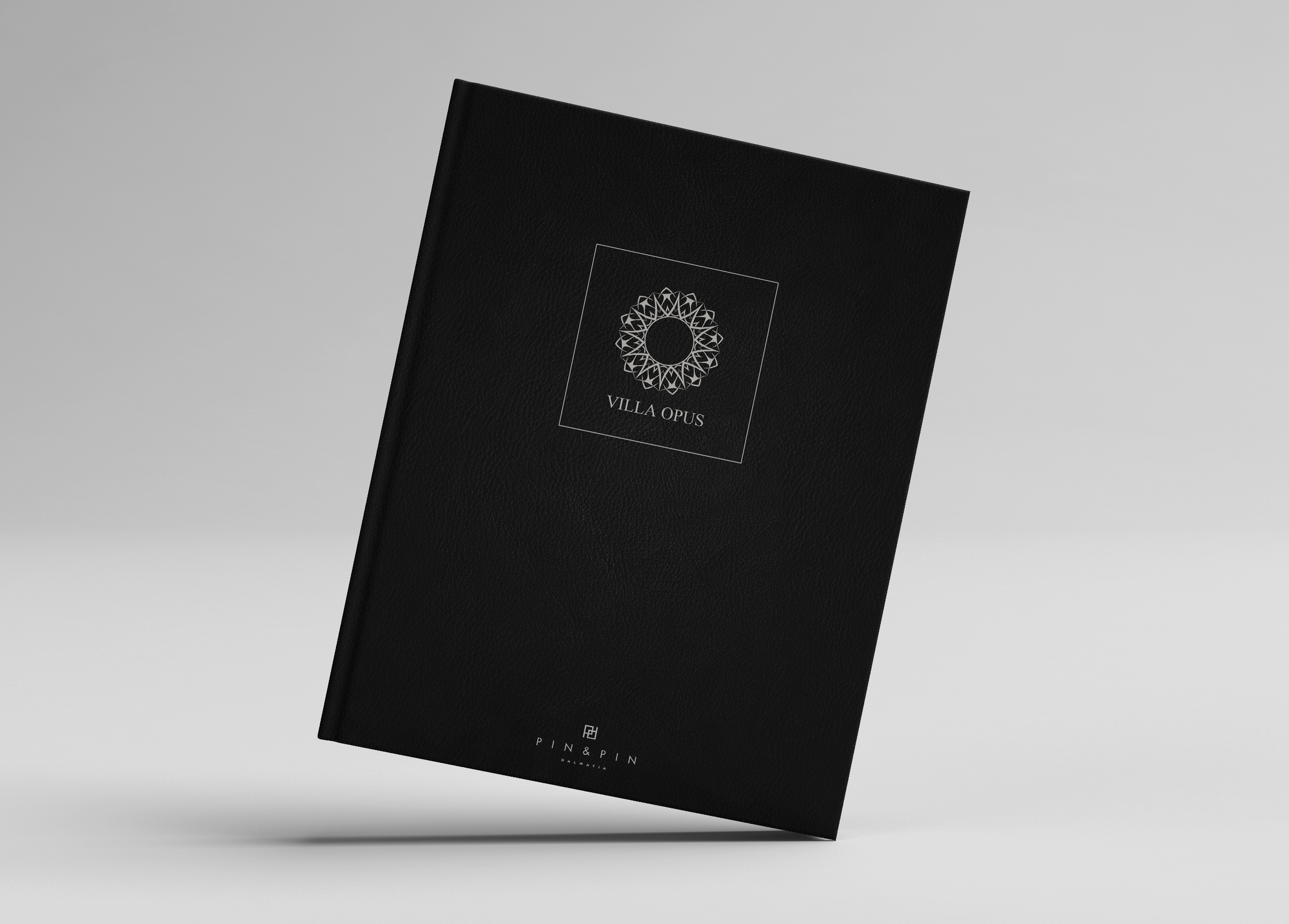 The black book cover with golden letters, standing on the white background.